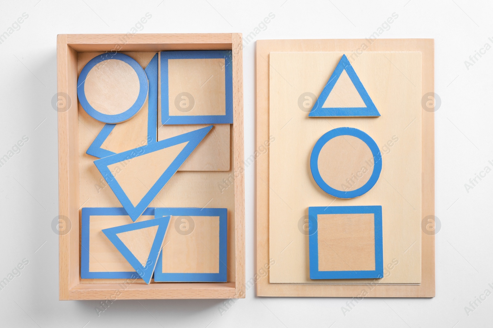 Photo of Set of plane geometric figures with box isolated on white, top view. Montessori toy