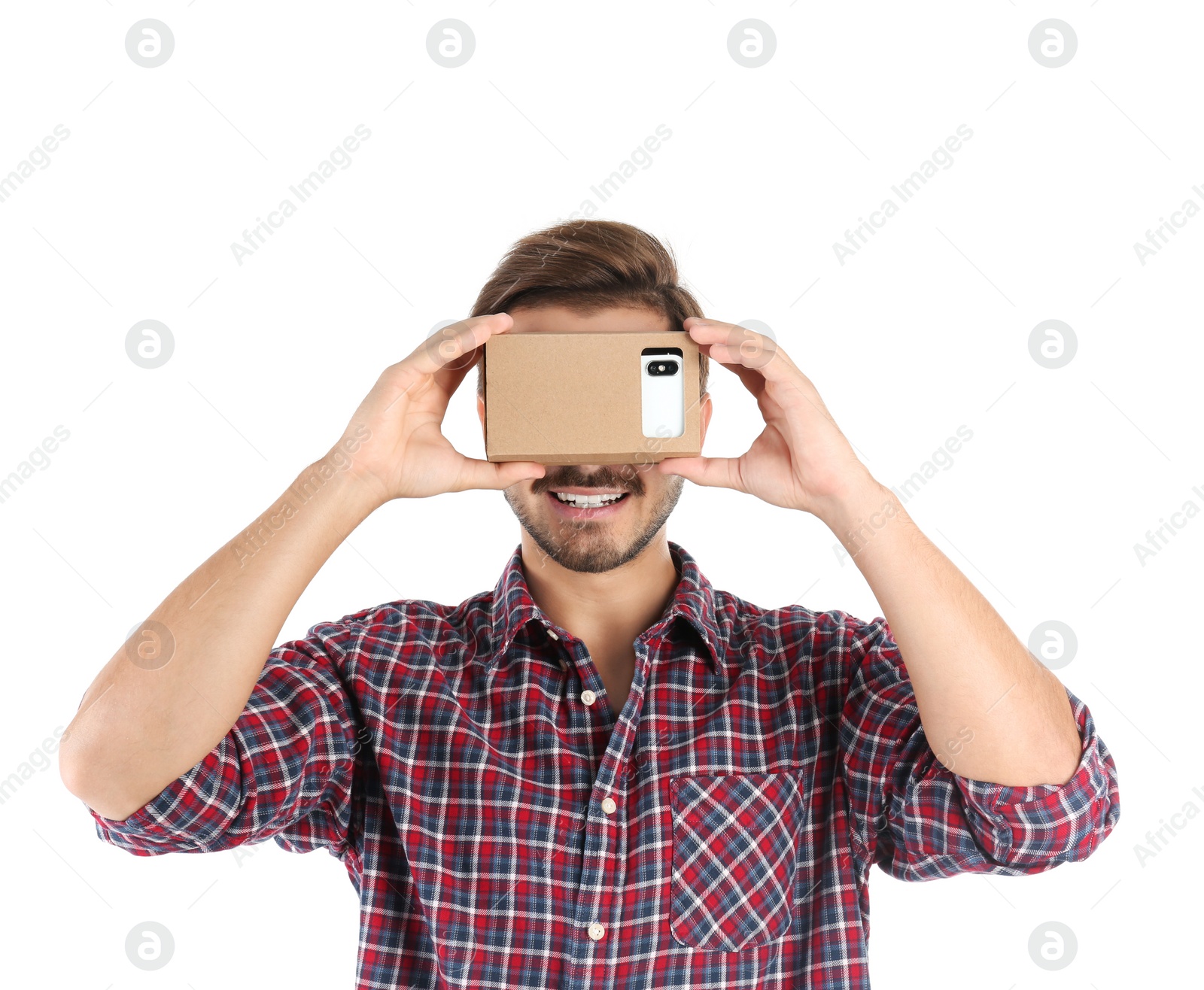 Photo of Young man using cardboard virtual reality headset, isolated on white