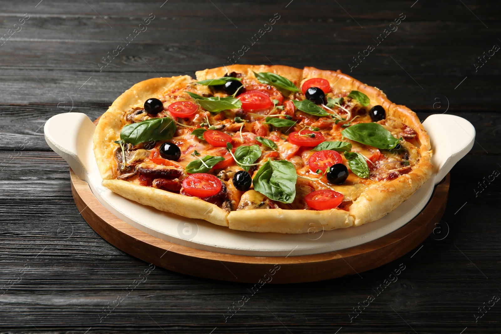 Photo of Tasty fresh homemade pizza on wooden table