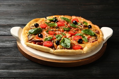 Tasty fresh homemade pizza on wooden table