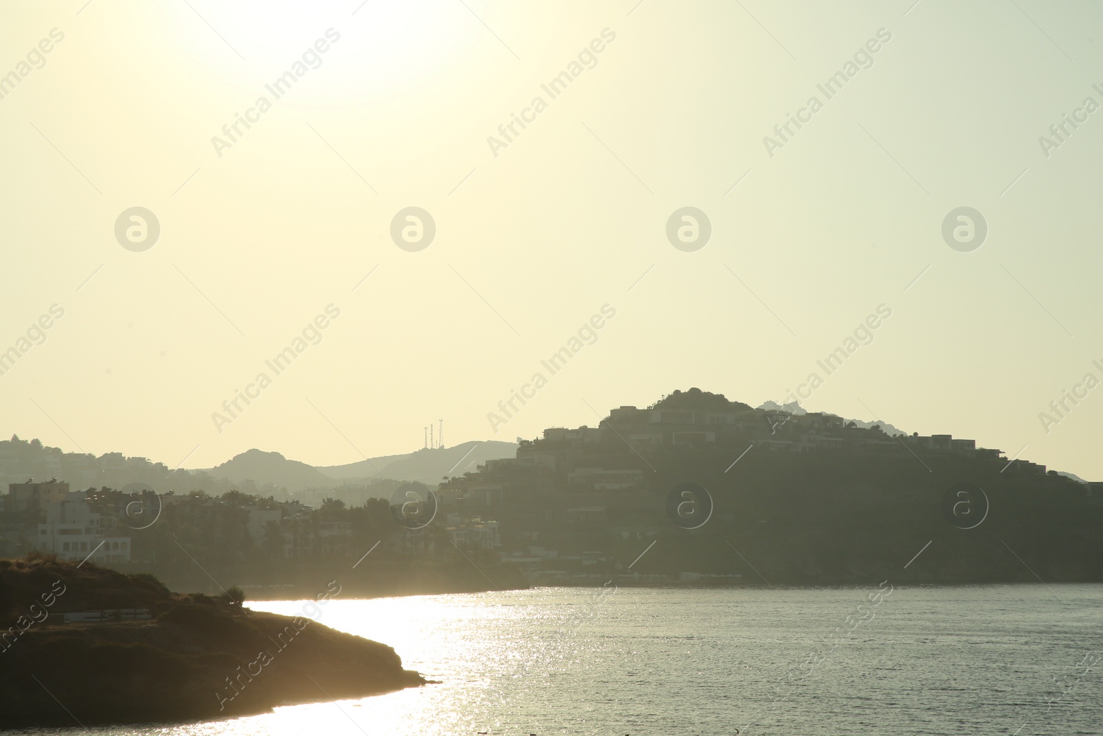 Photo of Beautiful view of calm sea and coastal city on sunny day