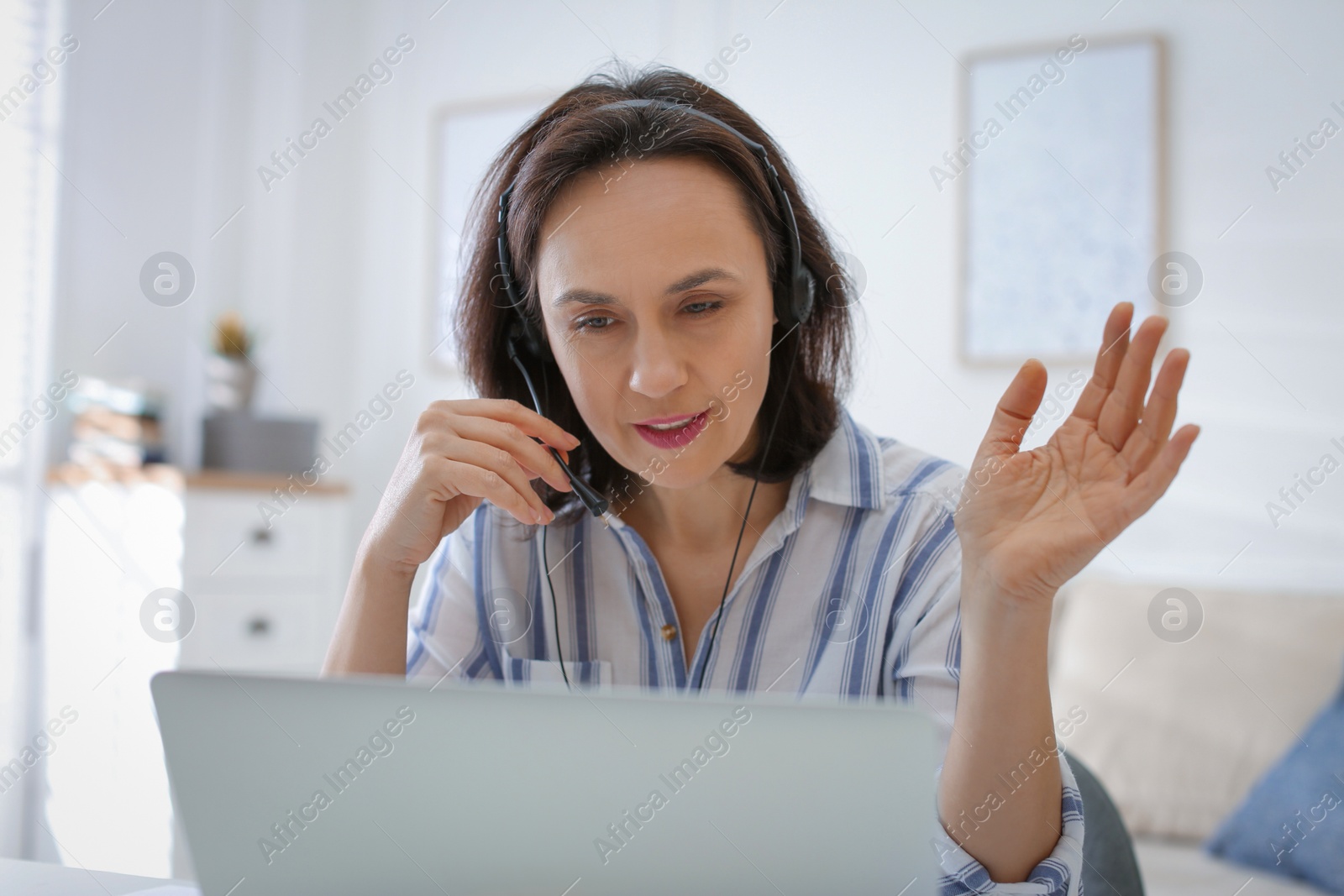 Photo of Teacher conducting online lesson at home during COVID-19 quarantine