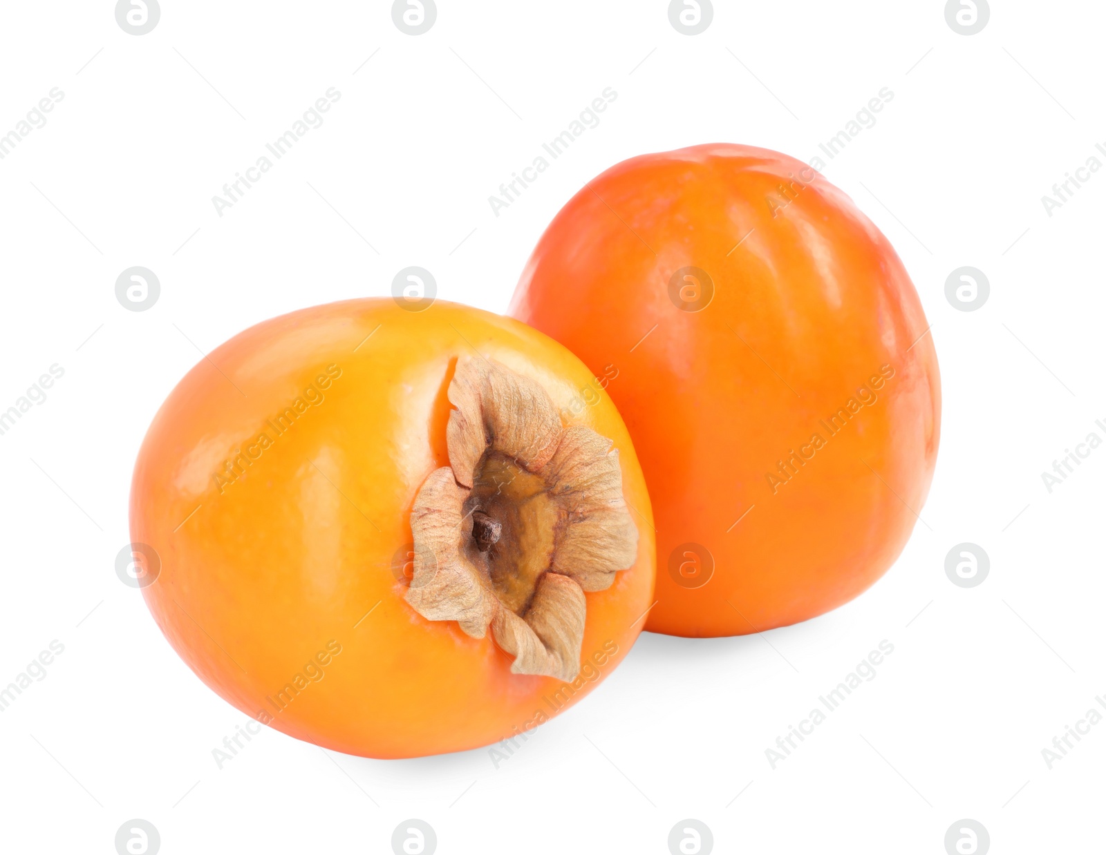 Photo of Delicious ripe juicy persimmons isolated on white