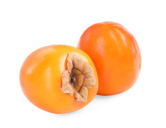 Photo of Delicious ripe juicy persimmons isolated on white