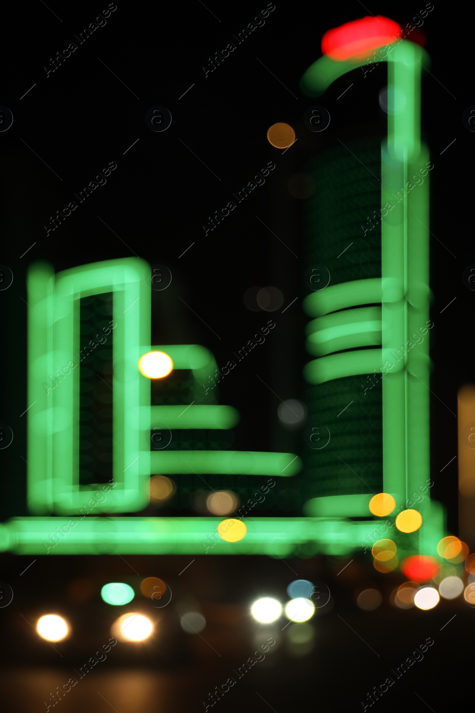 Photo of Blurred view of cityscape with bokeh effect. Night life