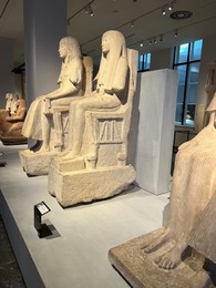 LEIDEN, NETHERLANDS - AUGUST 07, 2022: Display with Ancient Egyptian statues in National Museum of Antiquities (Rijksmuseum van Oudheden)