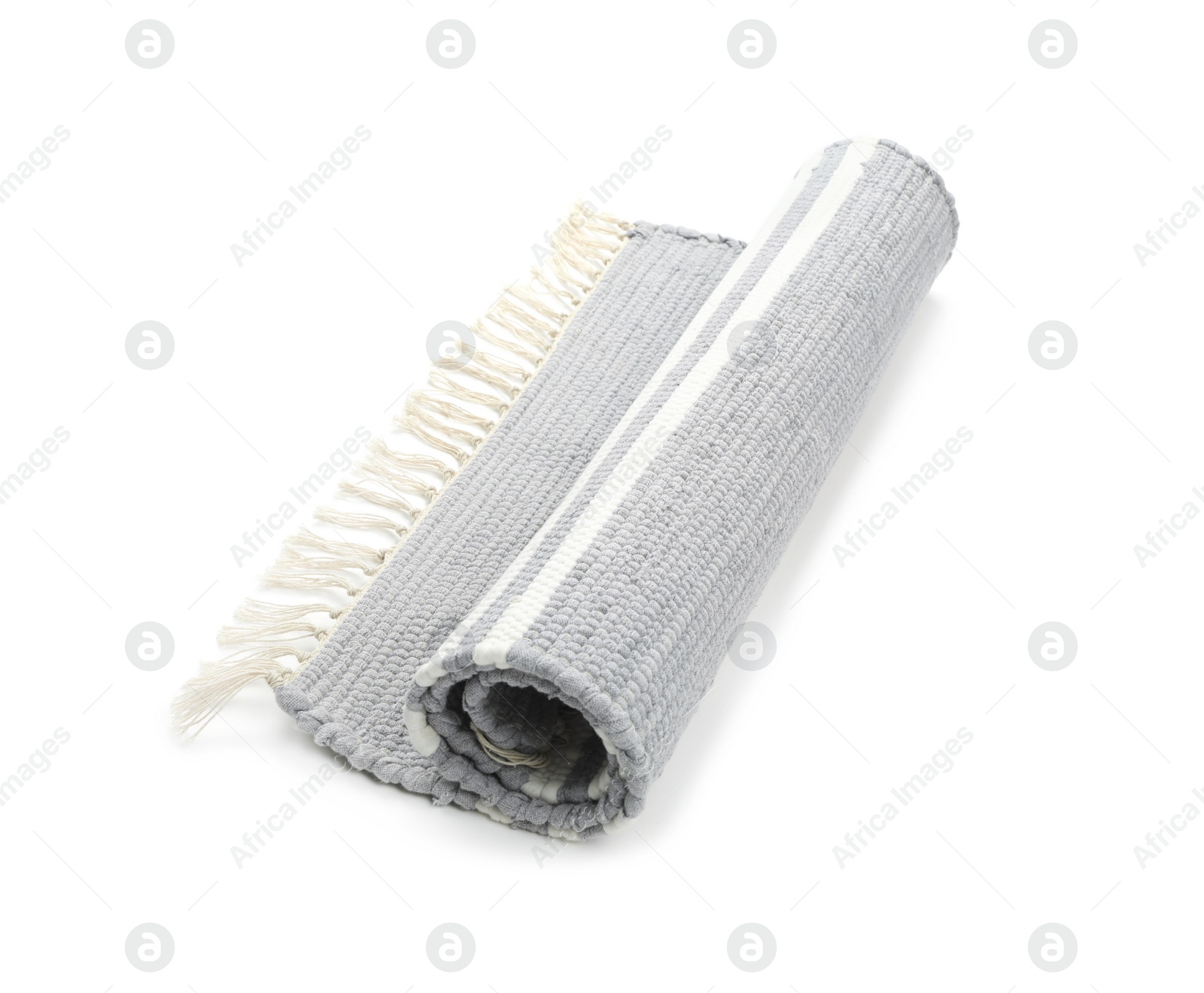 Photo of Stylish rolled light grey rug isolated on white. Interior accessory