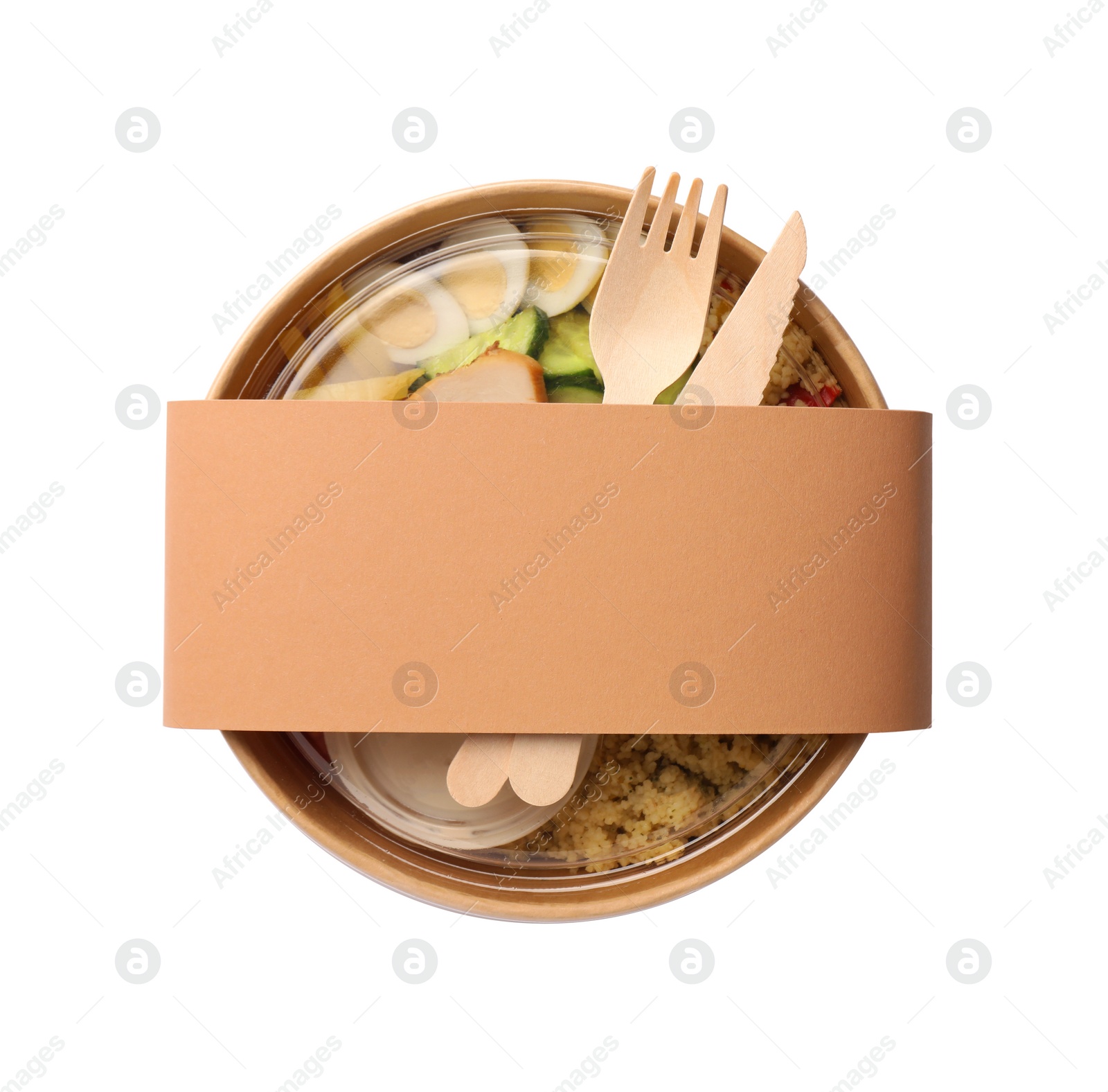 Photo of Tasty food in container with wooden fork and knife isolated on white, top view