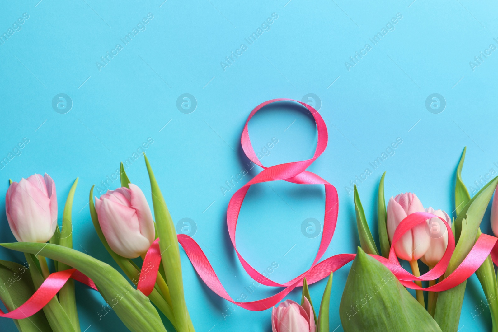 Photo of 8 March card design with tulips on light blue background, flat lay. International Women's Day