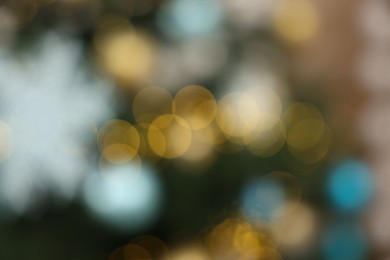 Photo of Christmas tree decorated for holiday, blurred view