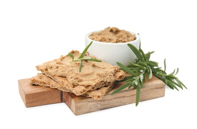 Photo of Crispy crackers with delicious meat pate and rosemary on white background