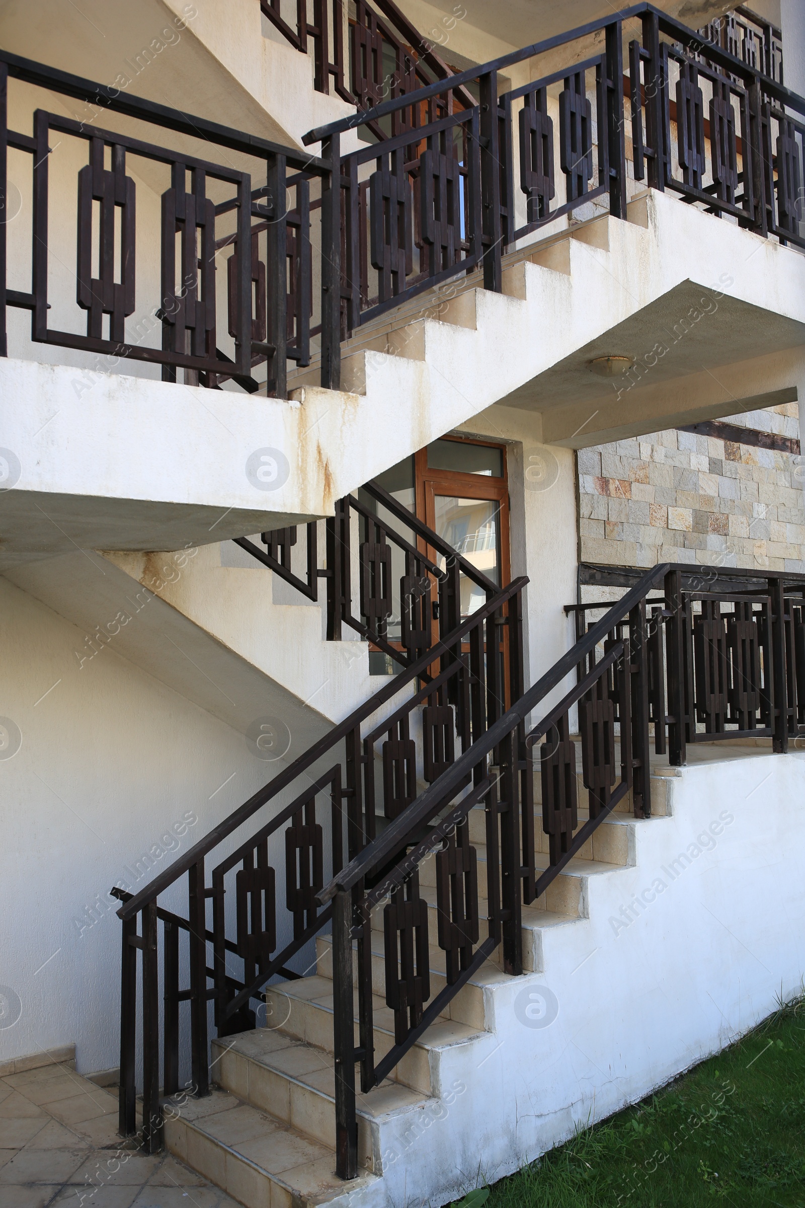 Photo of View of beautiful stairs with metal handrails near house outdoors