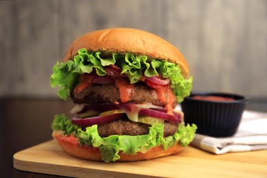 Photo of Board with tasty burger on table, closeup