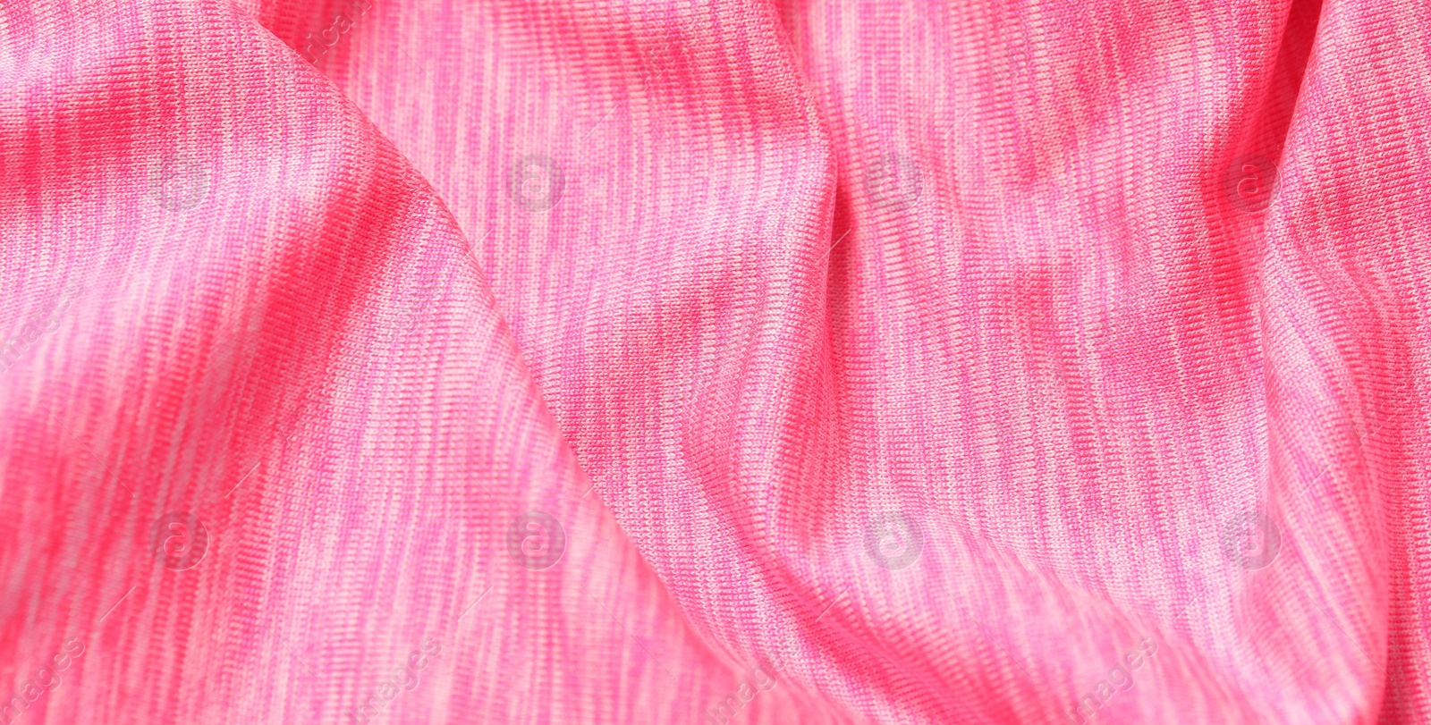 Photo of Texture of soft pink fabric as background, closeup