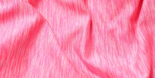 Texture of soft pink fabric as background, closeup