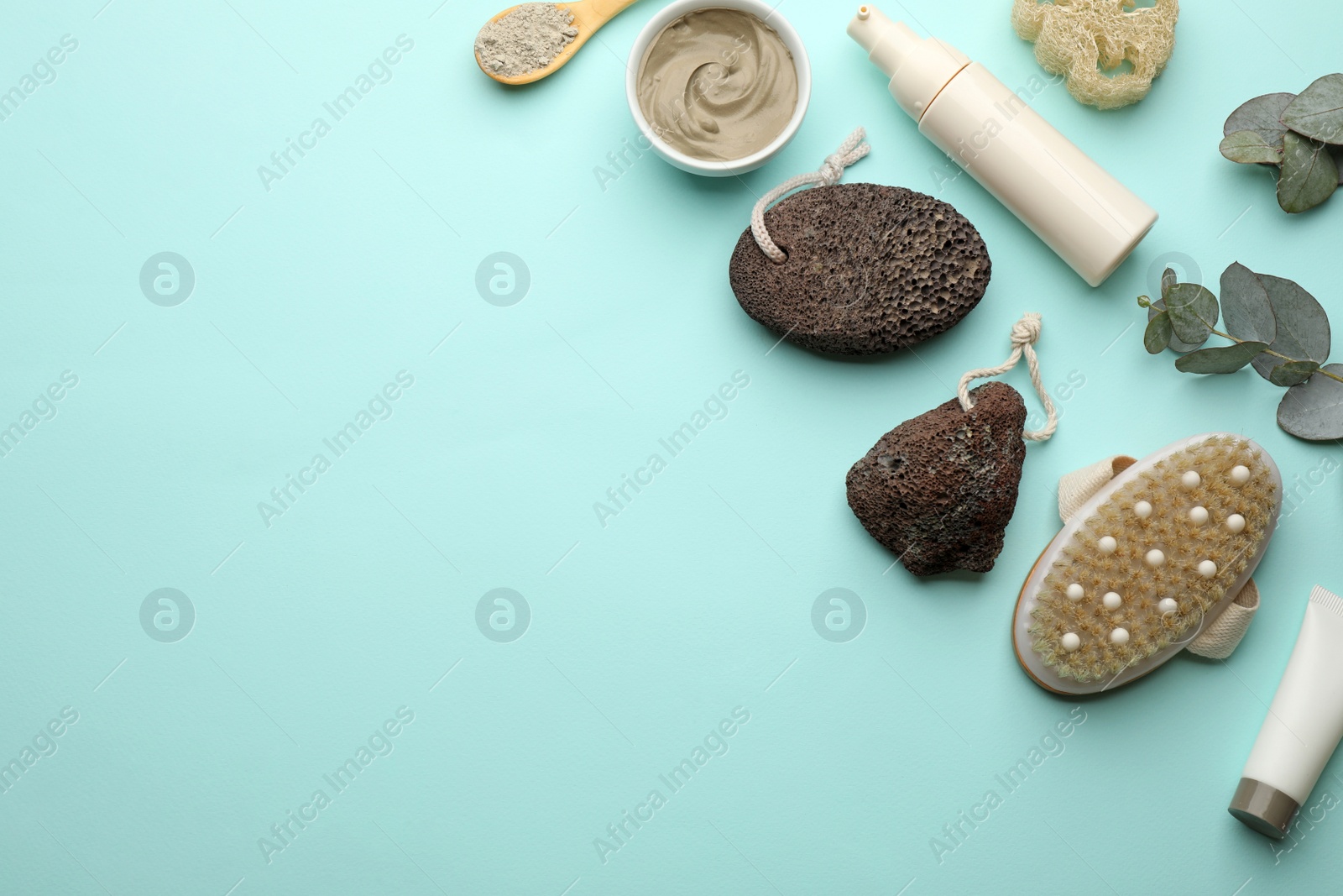 Photo of Flat lay composition with pumice stones on turquoise background. Space for text