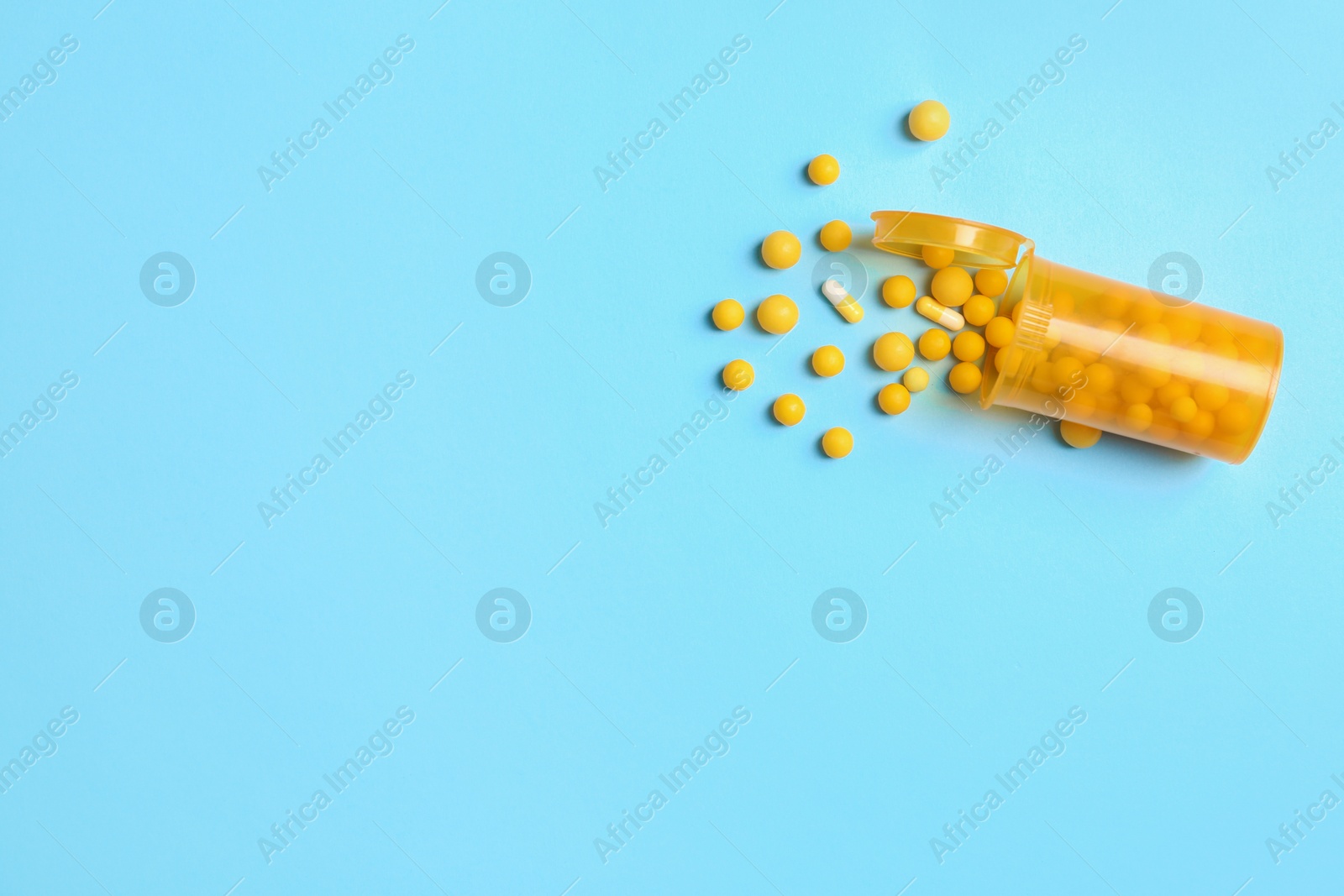 Photo of Flat lay composition with bottle, pills and space for text on color background