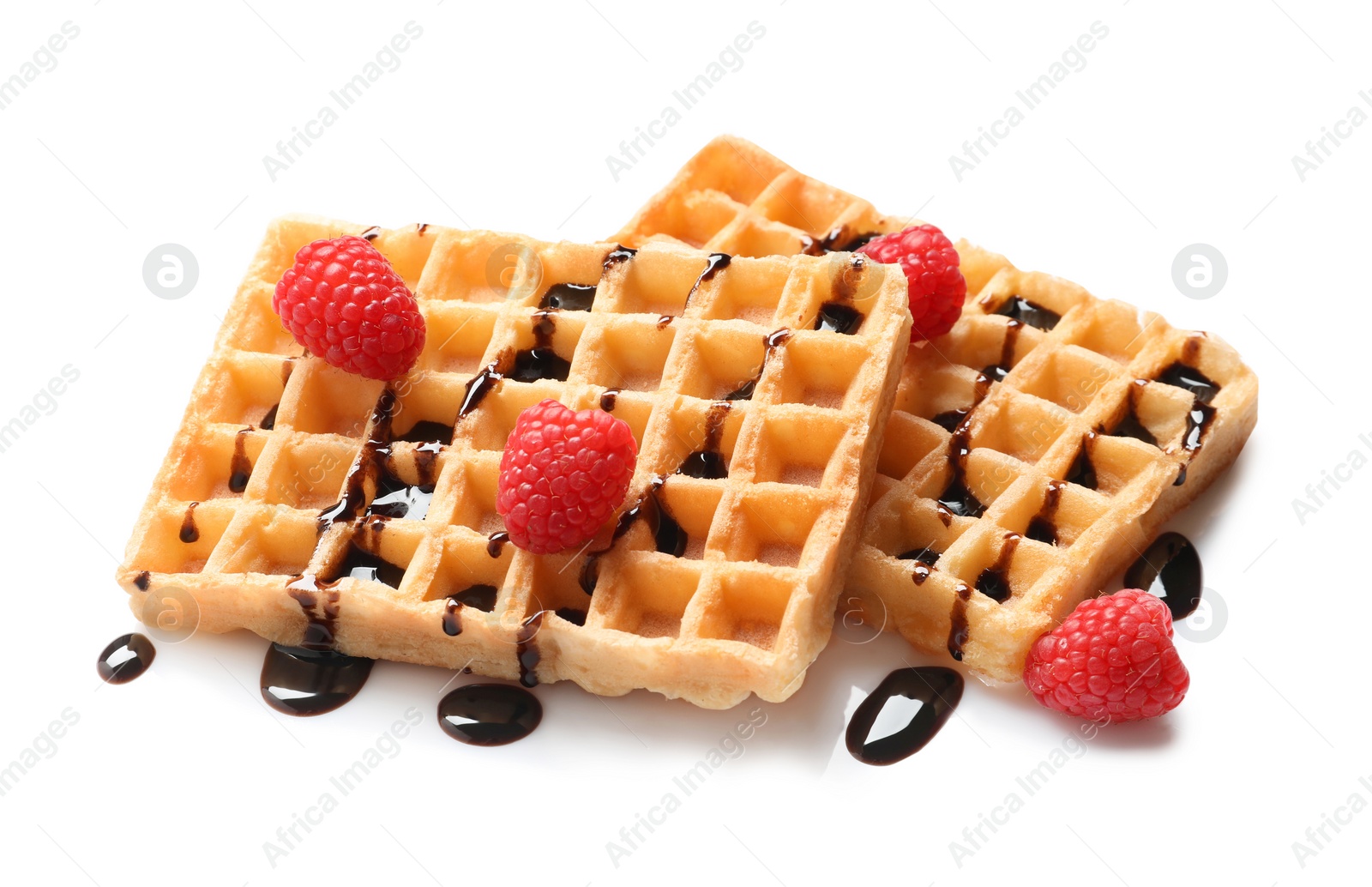 Photo of Delicious waffles with raspberries and chocolate syrup on white background