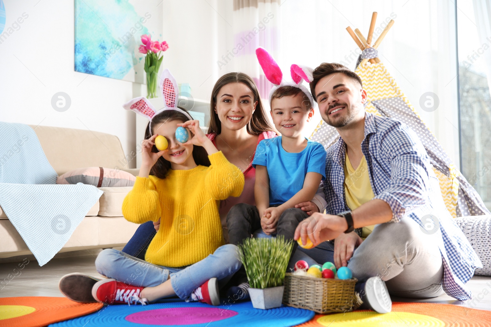 Photo of Happy family spending time together during Easter holiday at home