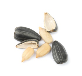 Photo of Raw peeled sunflower seeds and shell isolated on white, top view