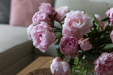 Beautiful pink peonies at home, closeup. Interior design