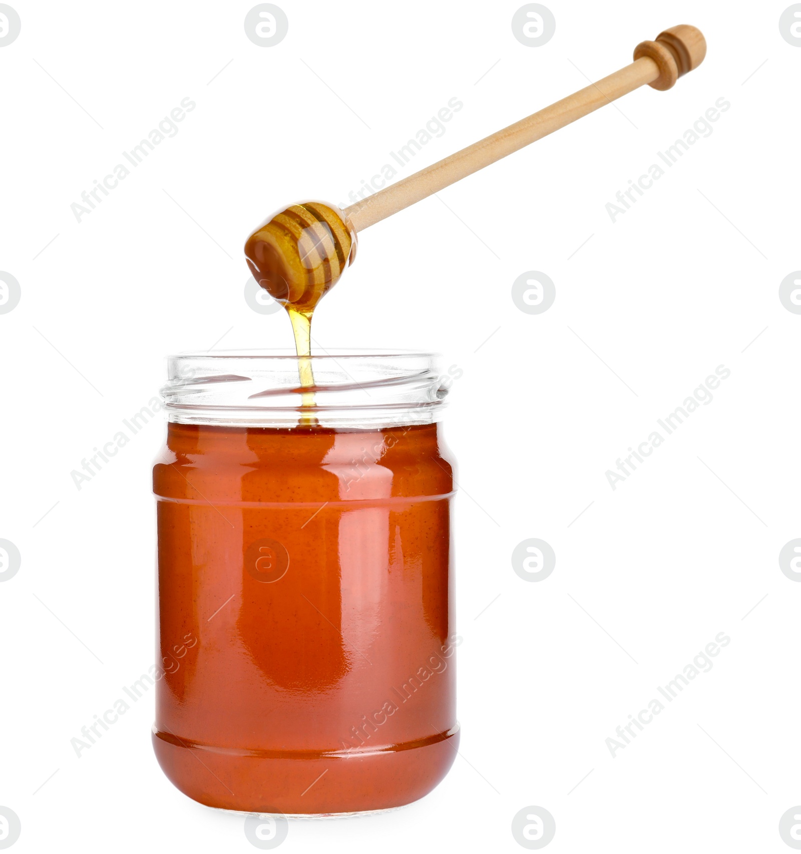 Photo of Glass jar of wildflower honey and wooden dipper isolated on white