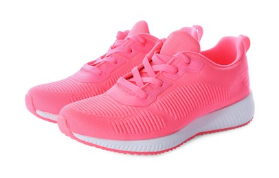 Photo of Pair of stylish pink sneakers on white background