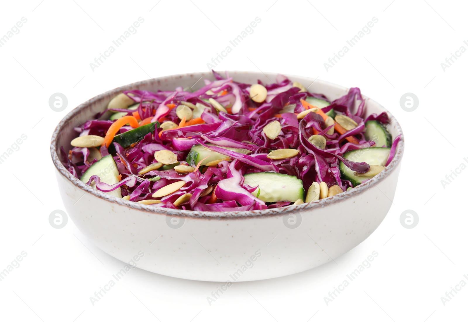 Photo of Tasty salad with red cabbage and pumpkin seeds in bowl isolated on white