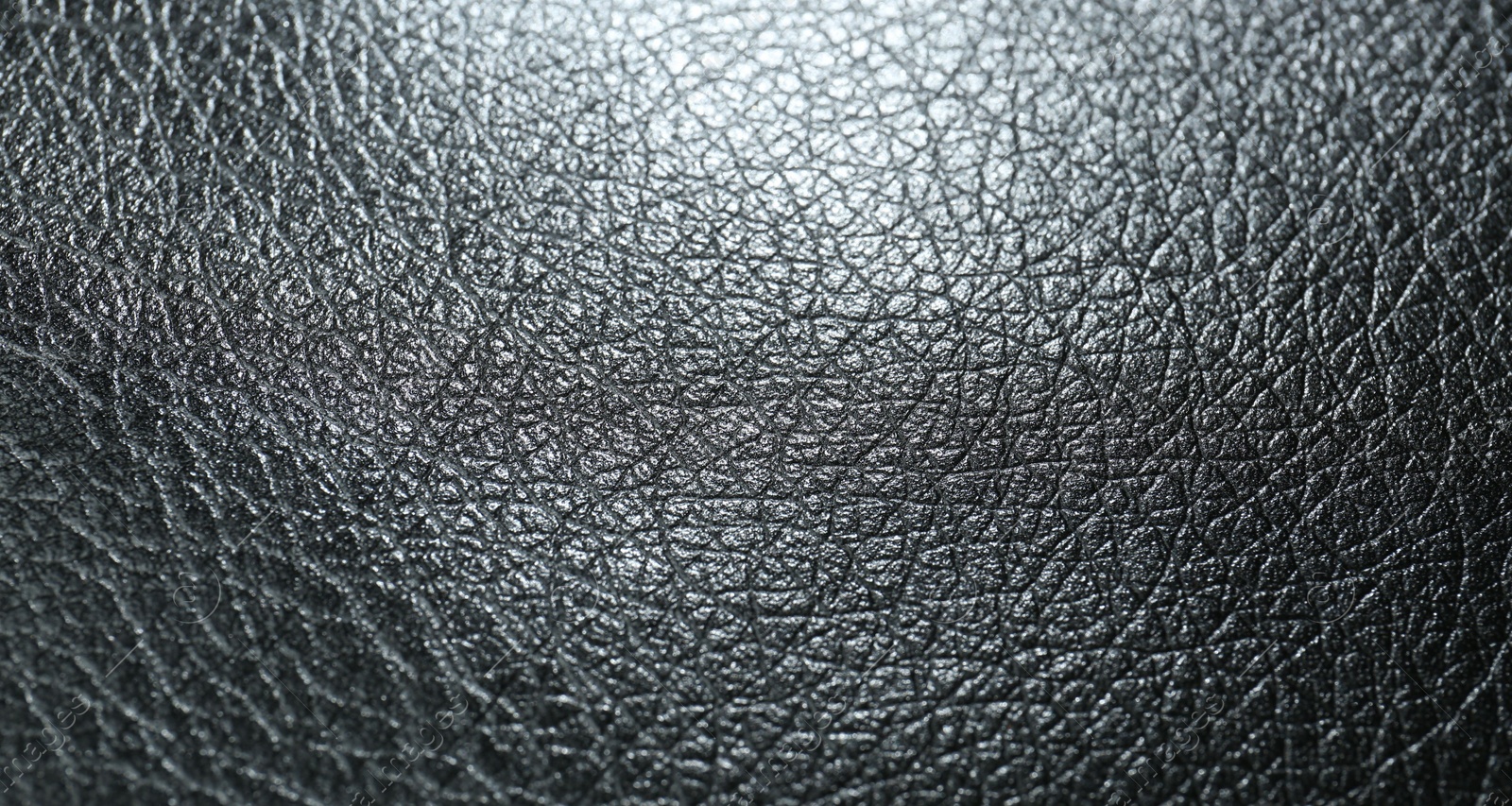 Photo of Texture of black leather as background, closeup