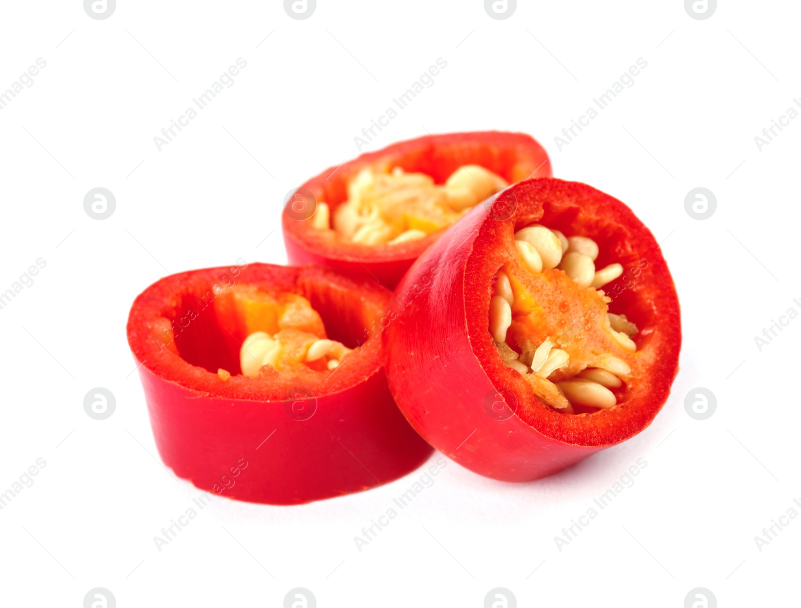 Photo of Slices of red chili pepper on white background