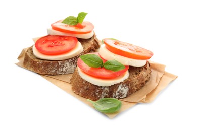 Photo of Delicious sandwiches with mozzarella, fresh tomatoes and basil on white background