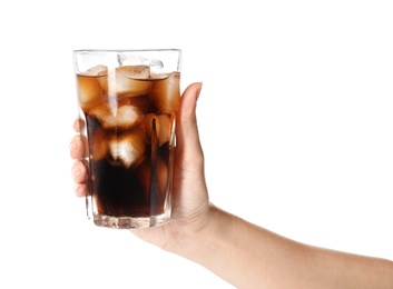 Woman holding glass of refreshing cola with ice on white background, closeup