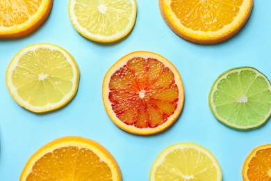 Photo of Different citrus fruits on color background, flat lay