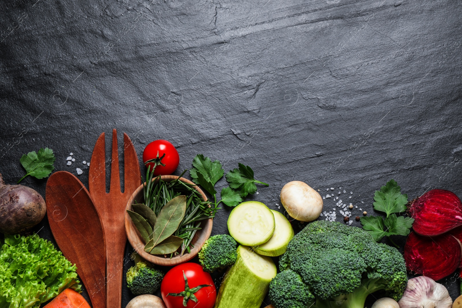 Photo of Flat lay composition with fresh products on grey table, space for text. Healthy cooking