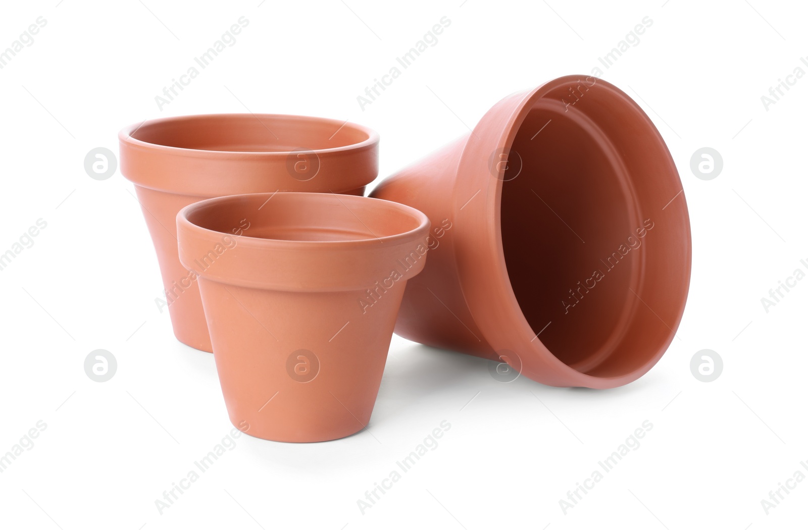 Photo of Stylish terracotta flower pots isolated on white