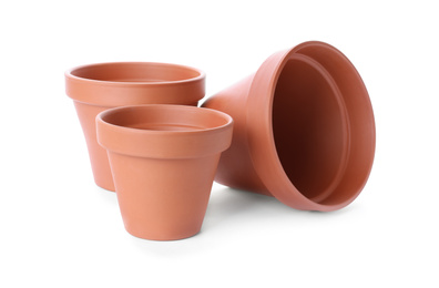 Photo of Stylish terracotta flower pots isolated on white