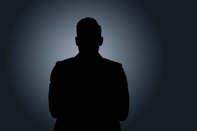 Photo of Silhouette of anonymous man on dark background