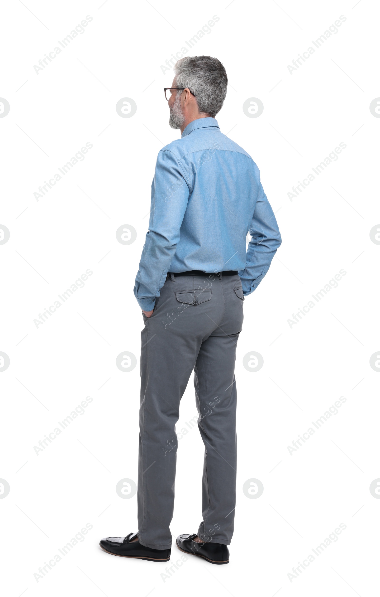 Photo of Mature businessman in stylish clothes posing on white background