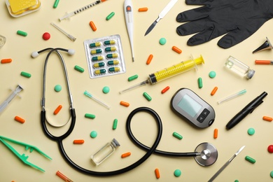 Photo of Flat lay composition with medical objects on color background