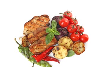 Photo of Tasty grilled vegetables, meat, fresh cherry tomatoes and basil isolated on white, top view