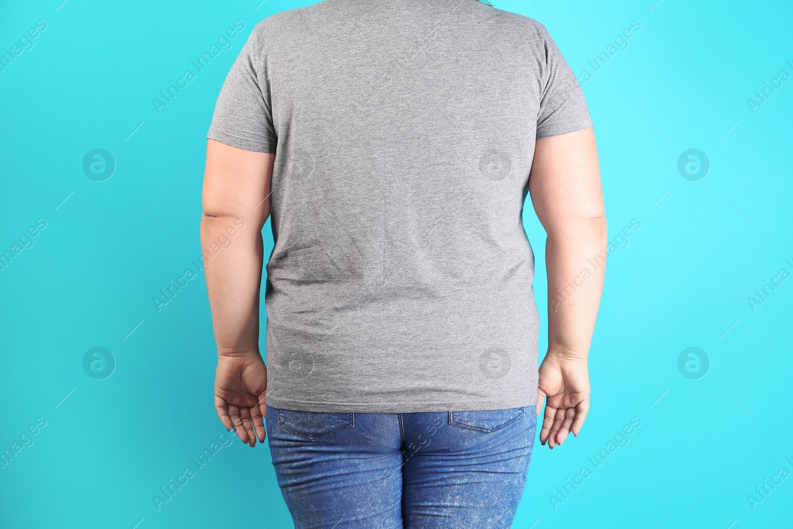 Photo of Overweight woman before weight loss on color background