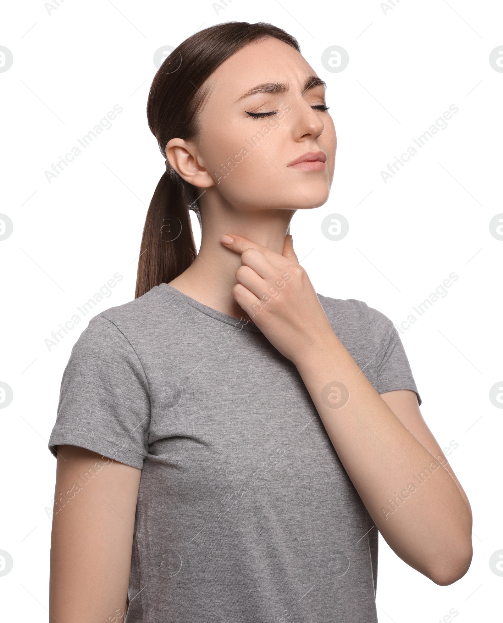 Photo of Young woman with sore throat on white background