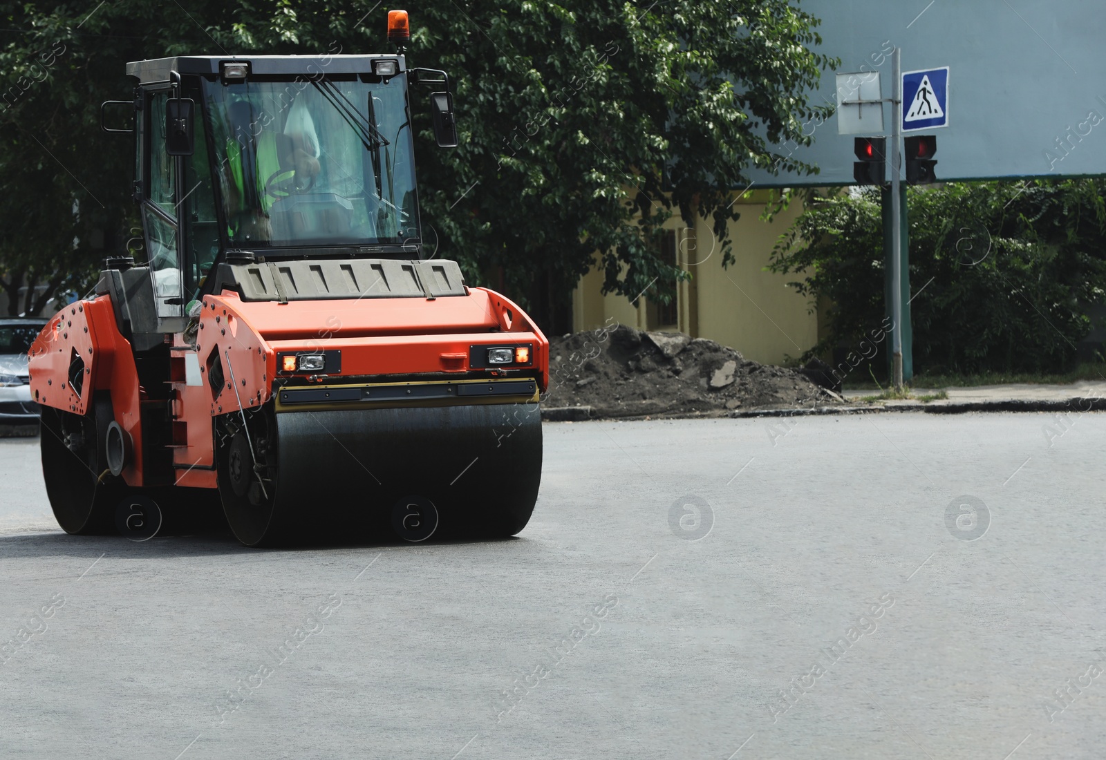 Image of Modern roller on city street. Road repair service