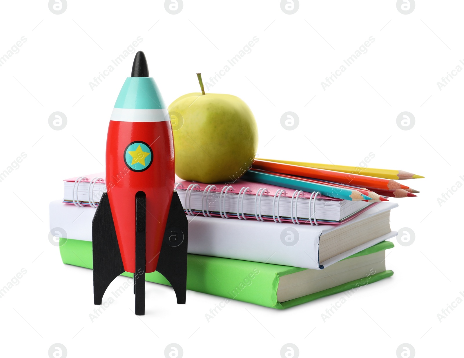 Photo of Bright toy rocket and school supplies on white background