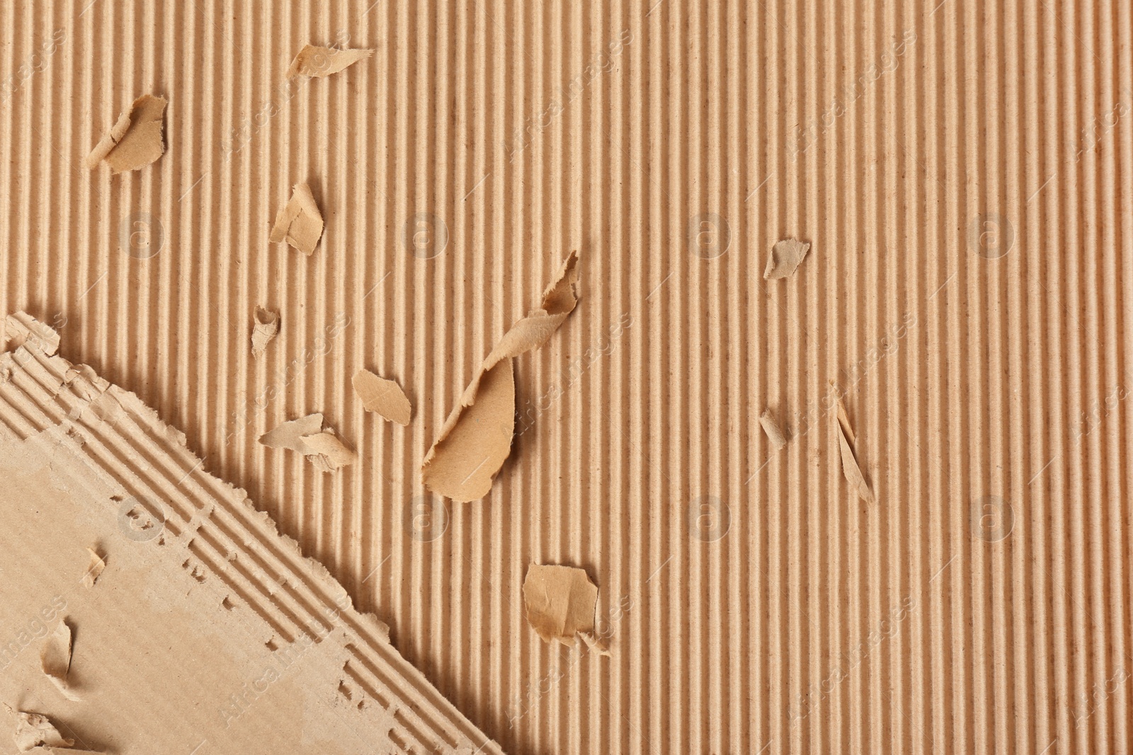 Photo of Corrugated cardboard surface as background, top view. Recyclable material