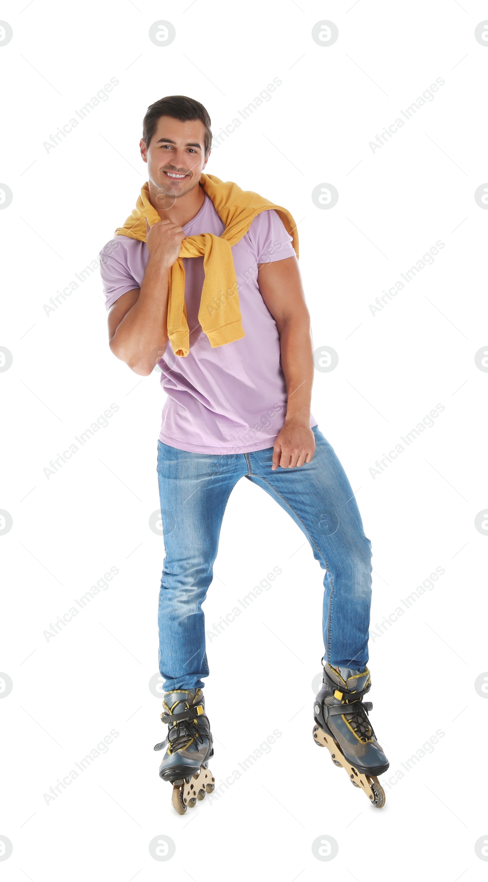 Photo of Handsome young man with inline roller skates on white background