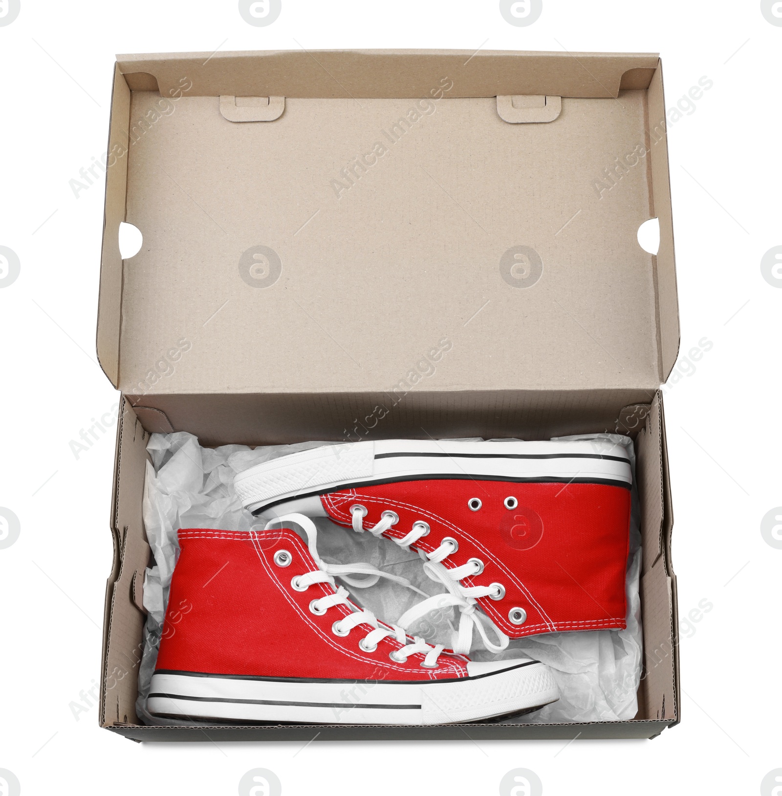 Photo of Pair of stylish sport shoes in cardboard box on white background, top view