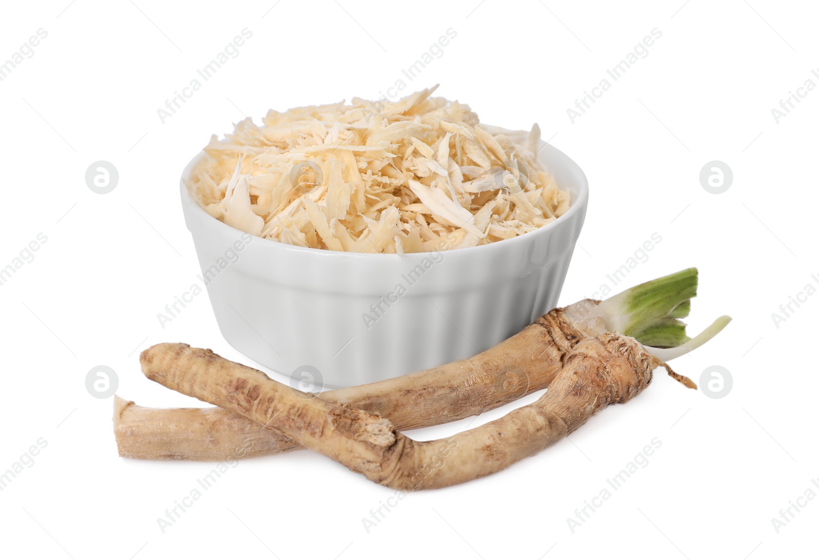 Photo of Grated and cut horseradish roots isolated on white