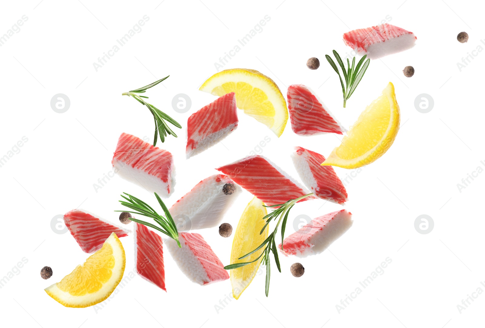 Image of Cut fresh crab sticks, lemon, rosemary and allspice falling on white background