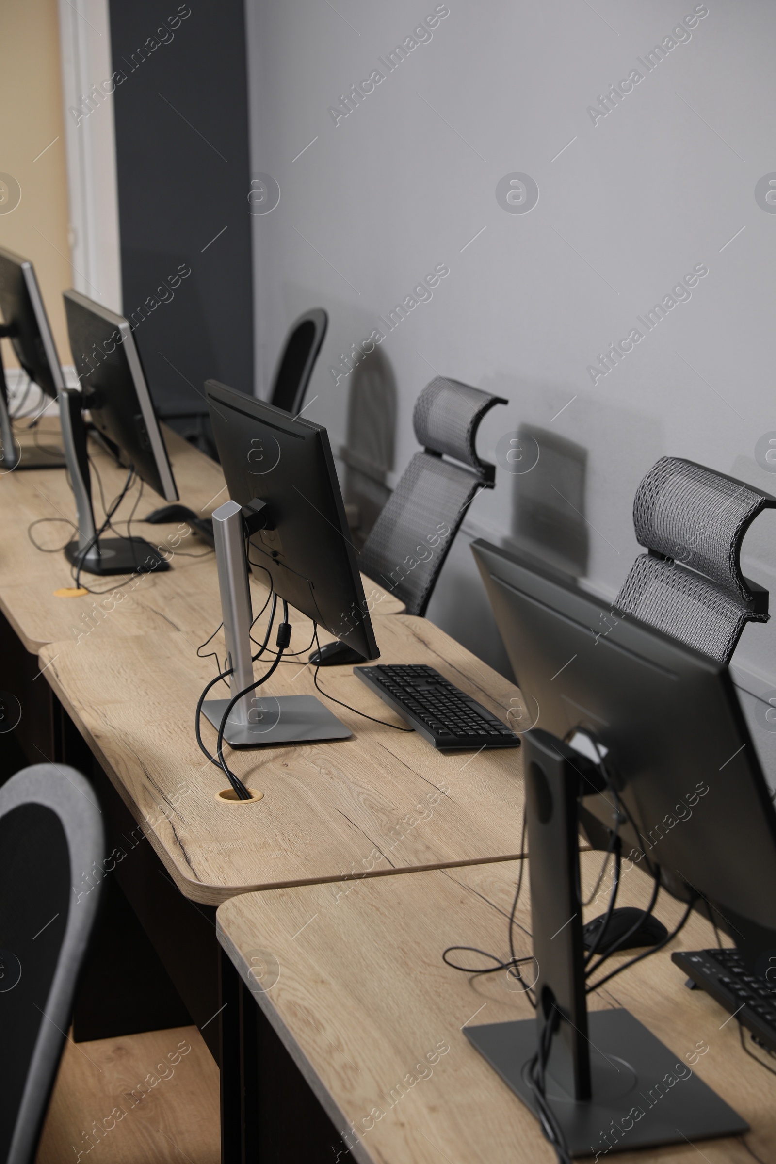 Photo of Many modern computers in open space office